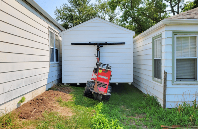 white shed being moved in Missouri